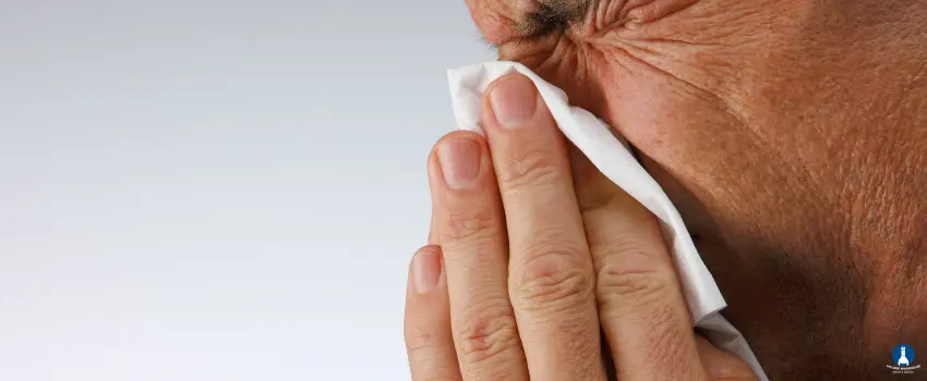 VWWS-Man blowing his nose to a tissue